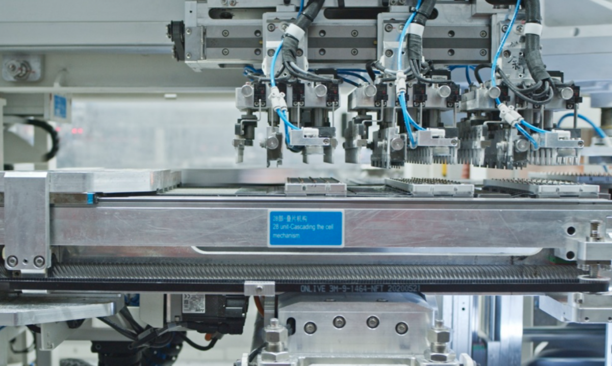 Automated machinery operating on a production line manufacturing solar cells